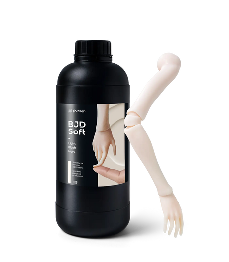 Bottle of Phrozen BJD Soft Light Blush Ivory 3D printer resin, 1kg, beside a printed ball jointed doll arm and hand.