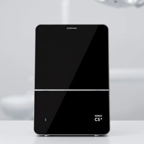 Phrozen Sonic CS+ dental resin 3D printer, front view, with a glossy black panel and touchscreen display.