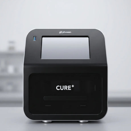 Phrozen Cure+ dental resin curing unit, front view, showing the touchscreen display and curing chamber.