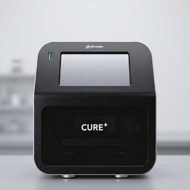 Phrozen Cure+ dental resin curing unit, front view, showing the touchscreen display and curing chamber.