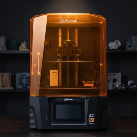 Phrozen Sonic Mighty Revo 16K resin 3D printer front view on dark hardwood bench in professional maker studio